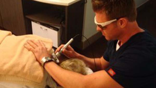 Chiropractor Hawthorne CA James Hogan Treating Patient