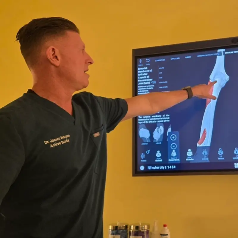 Chiropractor reviewing digital spine imaging in Culver City