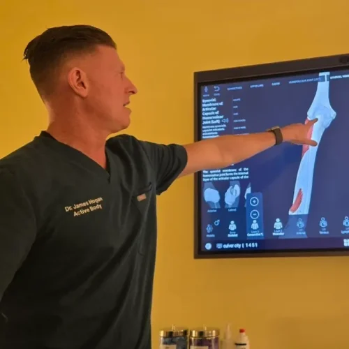 Chiropractor reviewing digital spine imaging in Culver City